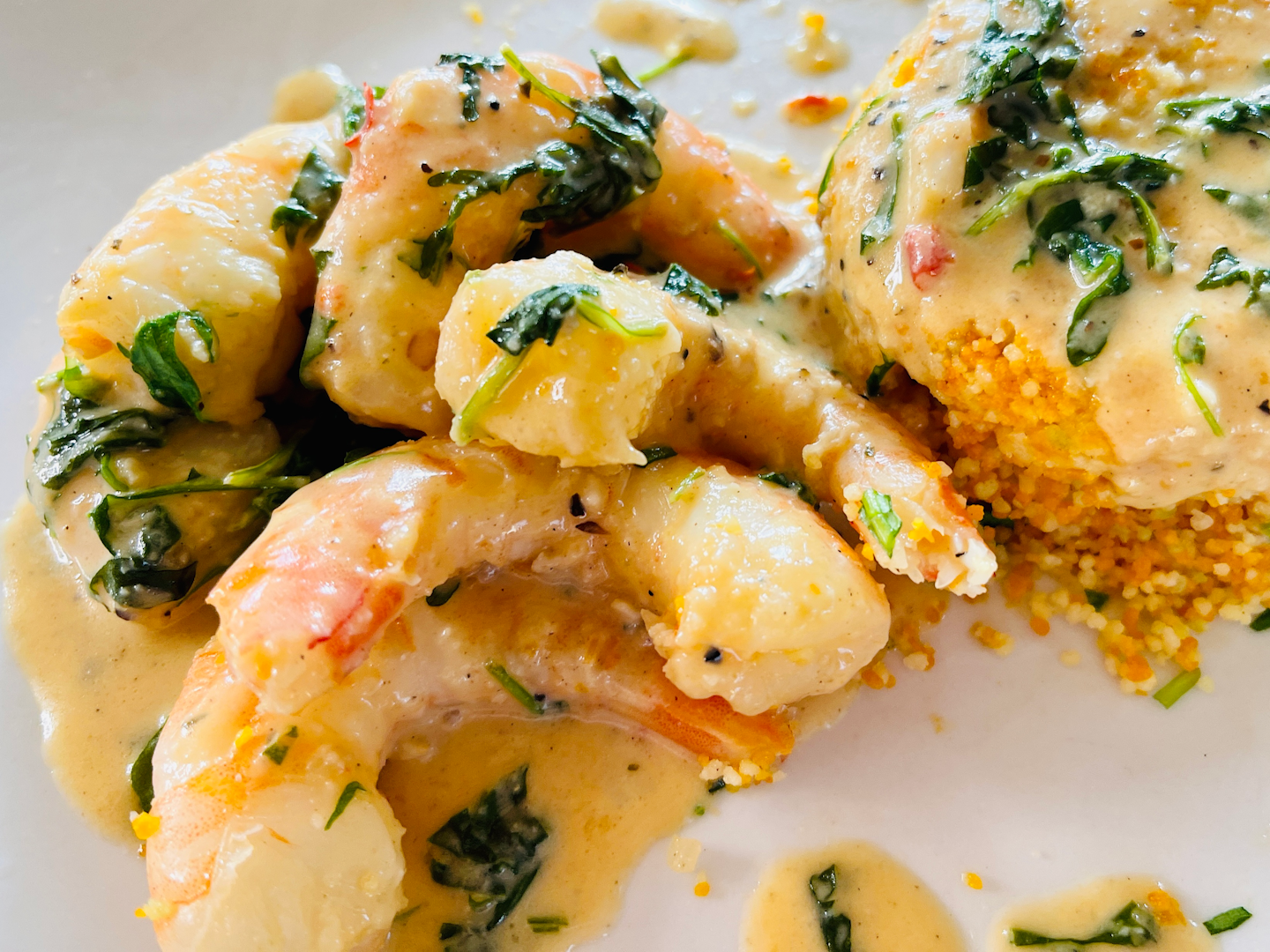 Pan roasted shrimp with arugula and sweet chili cream sauce.