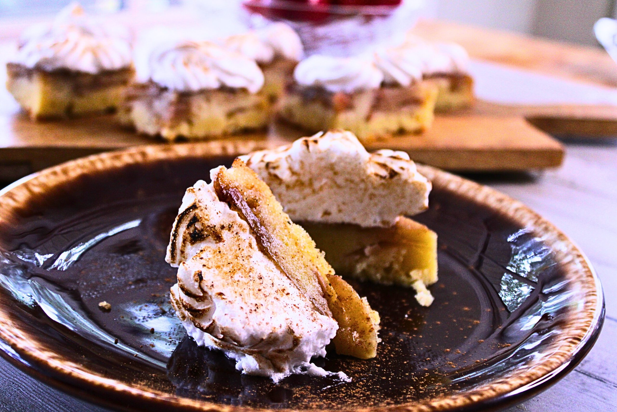 Luscious apple upside down cake. Rich apple filled butter cake with caramel and a toasted marshmallow frosting.